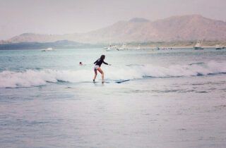 Surfing in Tamarindo Beach in Costa Rica.