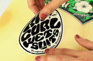 how to put stickers on a surfboard